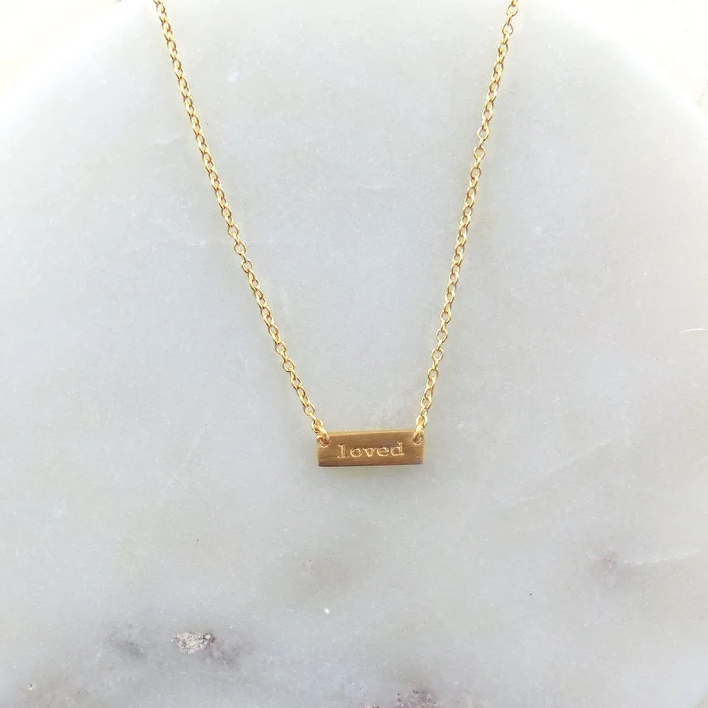 "LOVED" TINY PLATE BRUSHED GOLD NECKLACE